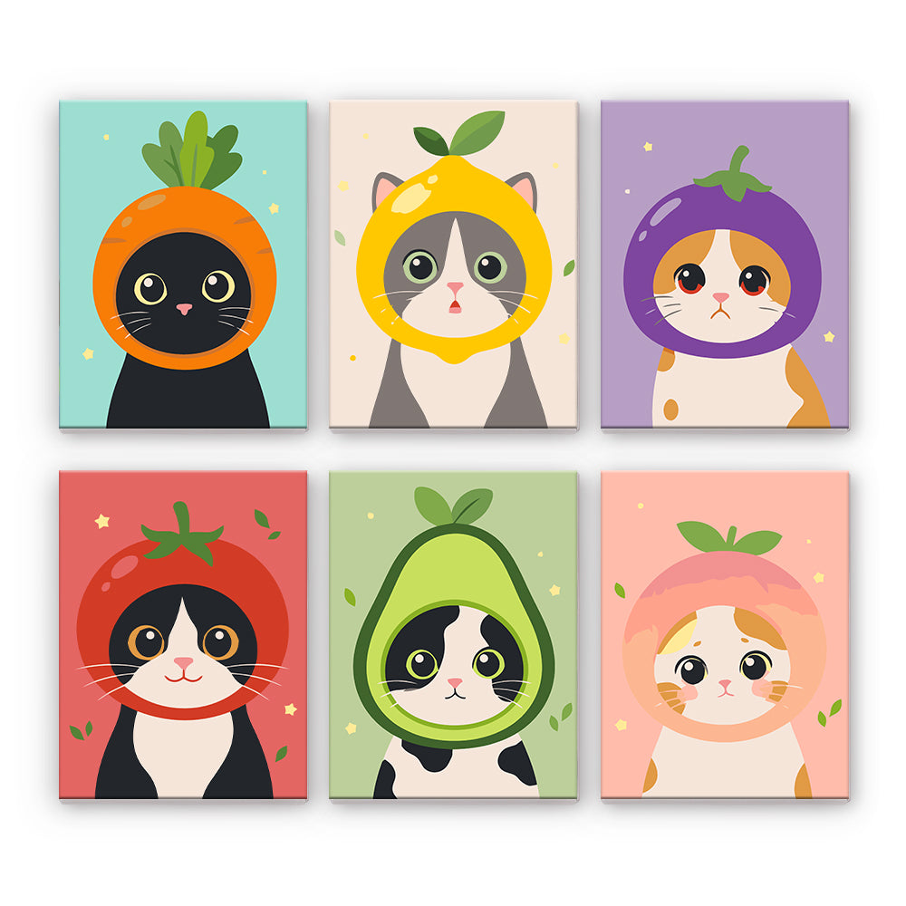 Gatti in costumi di frutta